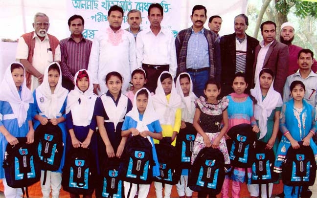 Guests are seen with meritorious students who achieved Anowara Almash Khatun Smriti Scholarship in Ctg recently.
