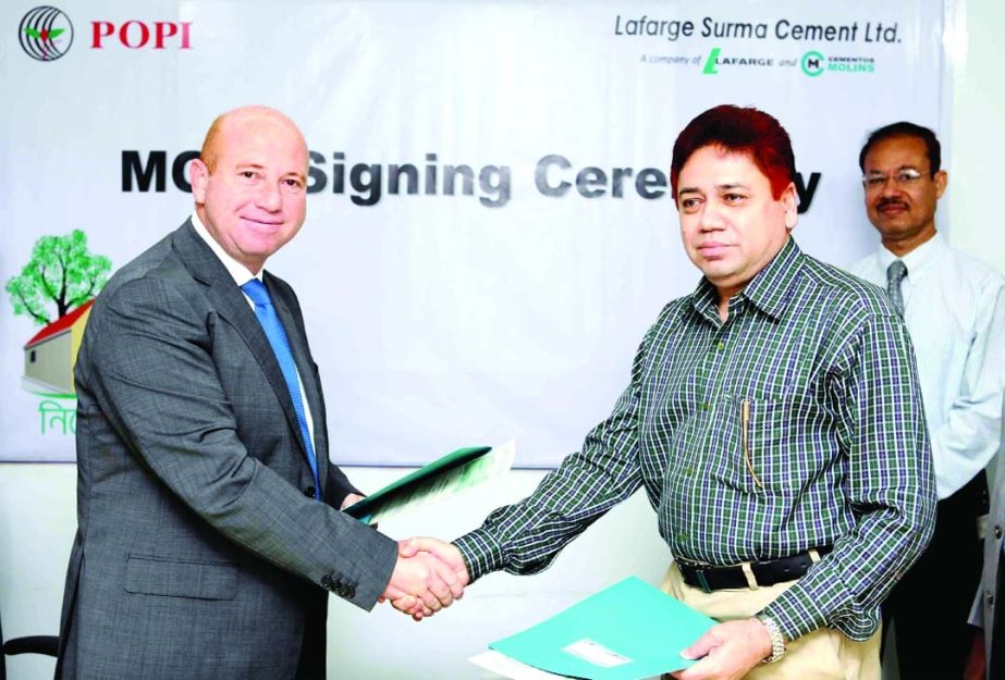 Tarek Elba, CEO of Lafarge Surma Cement Ltd. (LSC) and Murshed Alam Sarker, Executive Director of People's Oriented Program Implementation, one of the micro-finance institutions of Bangladesh, signed an agreement to launch a unique housing programme "Ni
