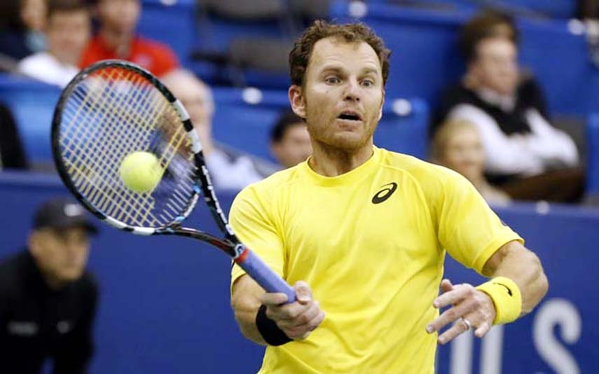 Michael Russell of the United States, hits a return to Kei Nishikori of Japan in the semifinals of the US National Indoor Tennis Championships in Memphis, Tenn. Nishikori won 6-3, 6-2 on Saturday.