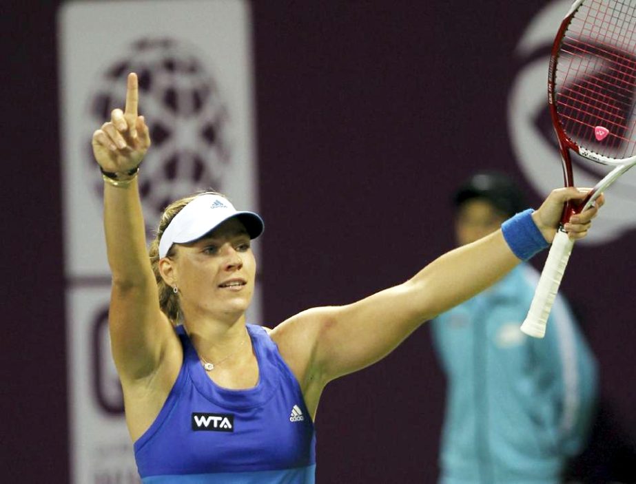 Angelique Kerber of Germany celebrates as she defeats Jelena Jankovic of Serbia during the semifinal of the WTA Qatar Ladies Open in Doha, Qatar on Saturday.