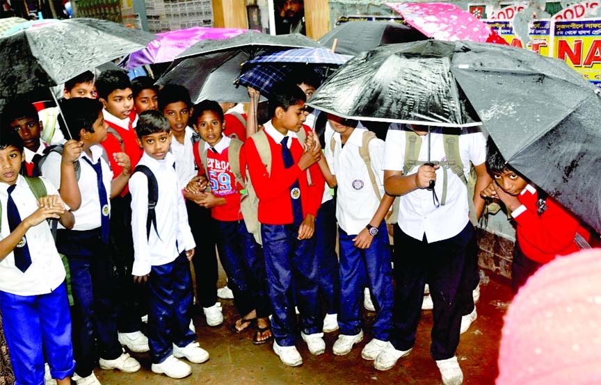 School going children are in trouble due to incessant drizzle. The snap was taken from Dhania area in the city on Monday.