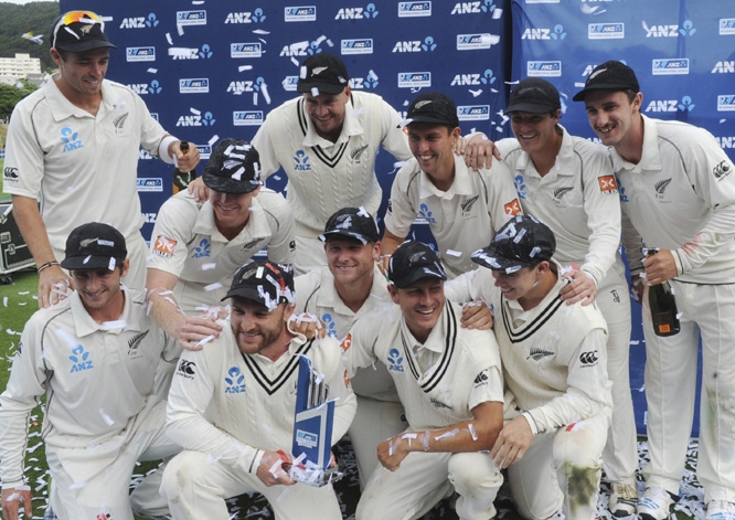 New Zealand team members celebrate their series win over India on the final day of the second test at the Basin Reserve in Wellington, New Zealand on Tuesday.