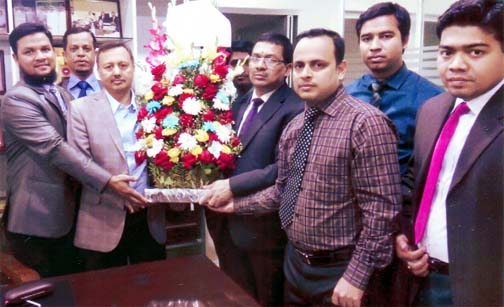 Senior officers of Union Bank, Khatungonj Branch seen presenting bouquet to Mahbubul Alam for being selected CIP in Industry category yesterday.