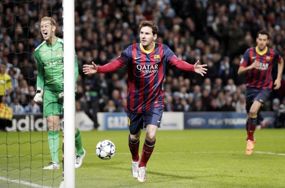 Barcelona's Lionel Messi celebrates scoring the opening goal during the Champions League first knock out round soccer match between Barcelona and Manchester City at the Etihad Stadium, Manchester, England on Tuesday.