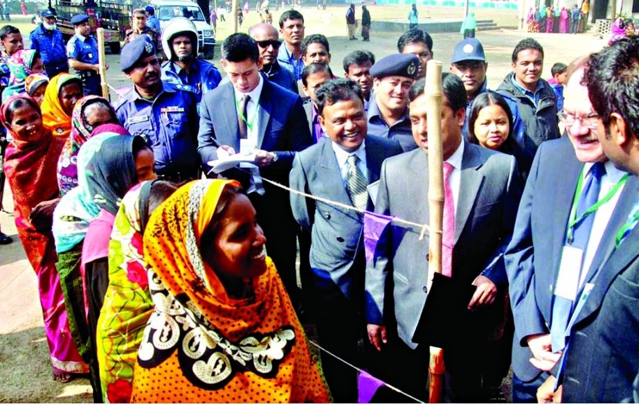 US Ambassador Dan W Mozena accompanied by Presiding Officer and polling agents visited the polling Centre and held talks with the voters of Mohanpur Upazila in Rajshahi on Wednesday.