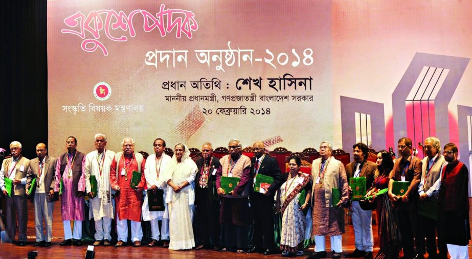 Prime Minister Sheikh Hasina along with the recipients of Ekushey Padak-2014 poses for photograph at the padak distribution ceremony in Osmani Memorial Auditorium in the city on Thursday.BSS photo nBSS photo