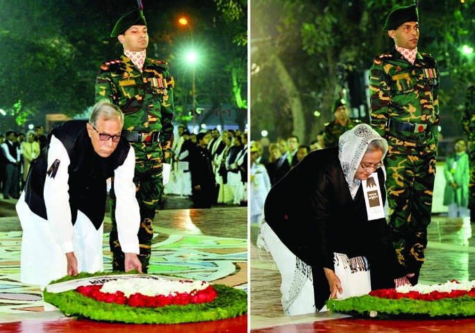 President Abdul Hamid and Prime Minister Sheikh Hasina placing floral wreaths at the altar of Central Shaheed Minar in the city on the first hour of Friday marking International Mother Language Day and \'Amar Ekushey\'. BSS photo