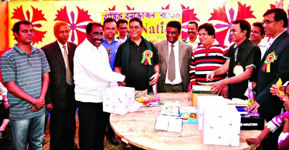 General Manager of the daily New Nation Syed Altaf Hossain along with other distinguished guests pose for photograph at the prize giving ceremony of raffle draw organized on the occasion of the New Nation family day and picnic held at Sonaimuri Amusement