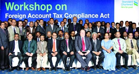 SK Sur Chowdhury, Deputy Governor of Bangladesh Bank attending a workshop on Foreign Account Tax Compliance Act (FATCA) and Sanctions Compliance for Financial Institutions in Bangladesh organized by Standard Chartered Bank Bangladesh on Sunday. Ali Reza