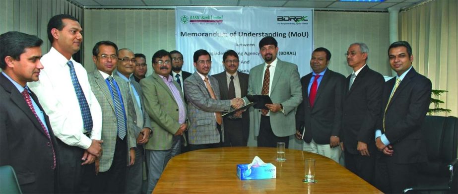 Kazi Faqurul Islam, Managing Director of BASIC Bank and Saikat Poddar, Managing Director of Bangladesh Rating Agency Ltd exchanging document of Memorandum of Understanding recently.