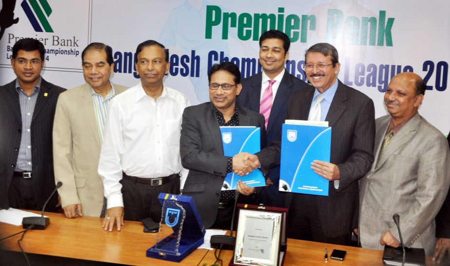 Senior Vice-President of Bangladesh Football Federation (BFF) Abdus Salam Murshedy shaking hands with Deputy Managing Director of Premier Bank Limited Dewan Abdul Latif after signing a Memorandum of Understanding at the conference room of BFF House on Mon