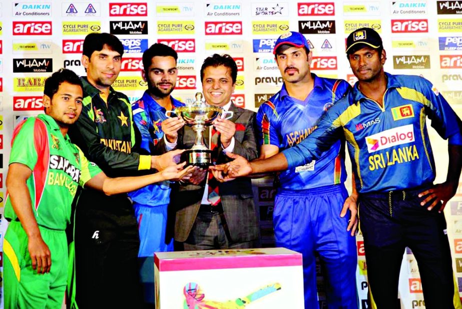 The five captains of the participating teams of Asia Cup pose with the trophy at the Pan Pacific Sonargaon Hotel in the city on Monday. Moin Ahmed