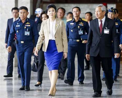 Thailand's Prime Minister Yingluck Shinawatra Â© leaves the Royal Thai Air Force headquarters after a cabinet meeting in Bangkok on Tuesday.