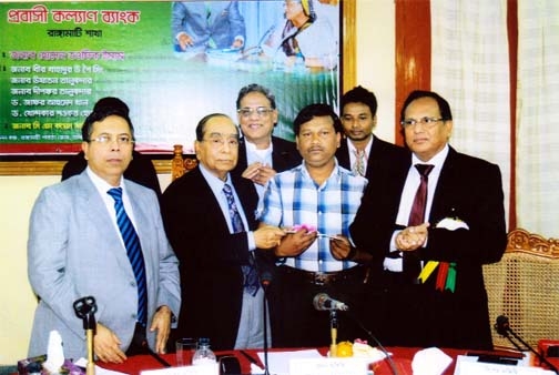 Political Adviser to the Prime Minister HT Imam distributing cheque for loan among the people willing to go abroad after inaugurating Rangamati Branch of Probashi Kallyan Bank recently.