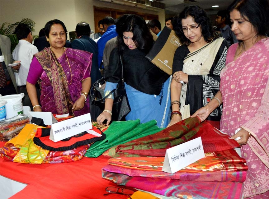 Visitors at a stall of the exhibition organized by Bangladesh Small and Cottage Industries Corporation at a hotel in the city on Tuesday.