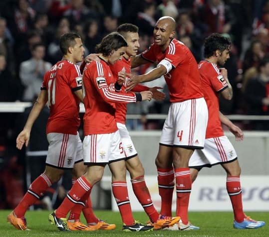 Benfica's players celebrate after Lazar Markovic from Serbia (2nd left) scored the opening goal during their Portuguese league soccer match with Guimaraes at Benfica's Luz stadium in Lisbon on Monday.