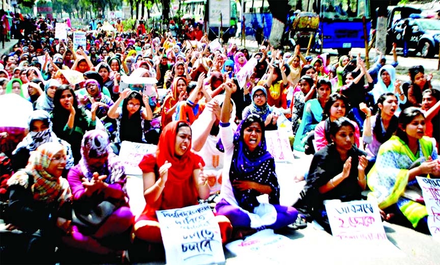 Students continue agitation by blocking road and reiterated their demand to declare the Eden College as full-pledged university. This photo was taken on Tuesday.