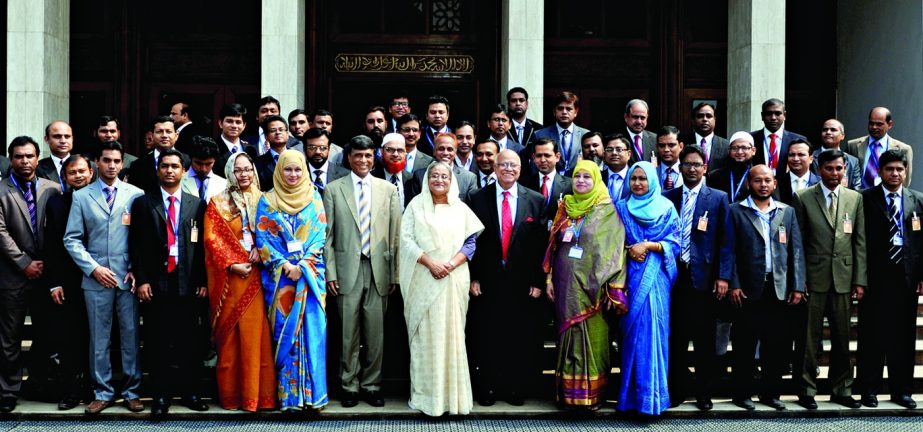 A delegation of Bangladesh Securities and Exchange Commission pose for photograph with Prime Minister Sheikh Hasina at her office on Wednesday after paying courtesy call on the latter. BSS photo