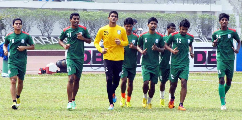 Players of Bangladesh National Football team during their practice session at the Bangabandhu National Stadium on Wednesday. Bangladesh National Football team will play a FIFA friendly football match against Indian National Football team at Goa in India o