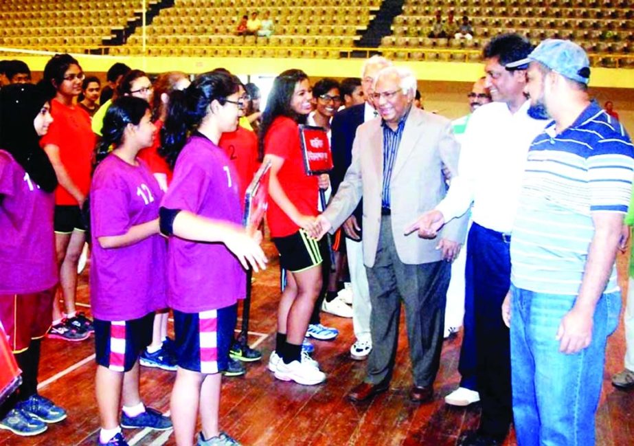 Chairman of Tournament Committee and Managing Director of Orient Food Company Ltd Mahbub Uz Zaman being introduced with the players of the Orient Bread School Volleyball tournament at Shaheed Suhrawardy Indoor Stadium in Mirpur on Friday.