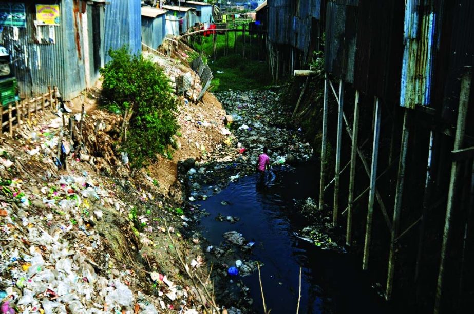 Once the mighty canal in city's Bashabo area land grabbers and influential persons are establishing their hold on it by raising temporary houses while people are facilitating it by dumping garbage.