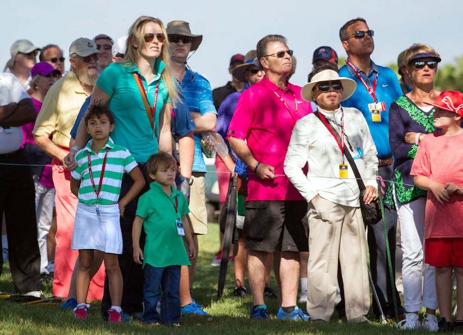 Lindsey Vonn, joined by Tiger Woods' children, Sam Alexis and Charlie Axel, watches Woods tee off on the 11th hole during the second round of the Honda Classic golf tournament in Palm Beach Gardens, Fla on Friday.