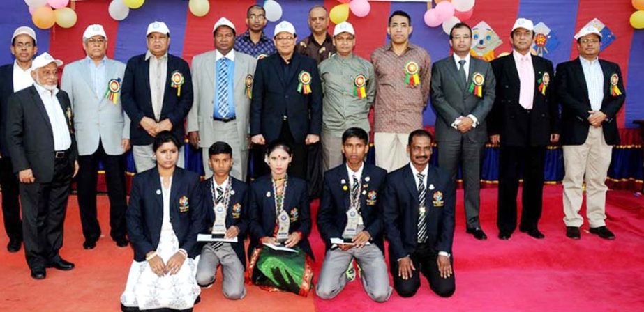 The winners of the Annual Sports Competition of Prayash with the chief guest Governor of Bangladesh Bank Atiur Rahman pose for a photo session at the Dhaka Cantonment on Saturday .