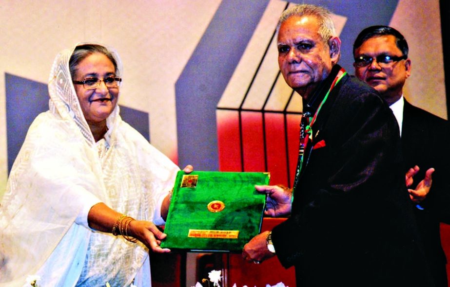 Prime Minister Sheikh Hasina handing over 'Ekushey Padak' to language veteran Lion Shamsul Huda recently at Osmani Memorial Auditorium in the city for his contribution in the language movement.