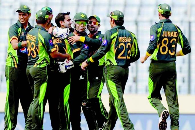 Pakistan players celebrate after Mohammad Hafeez removed India opener Shikhar Dhawan for just 10 in the third over on Sunday.