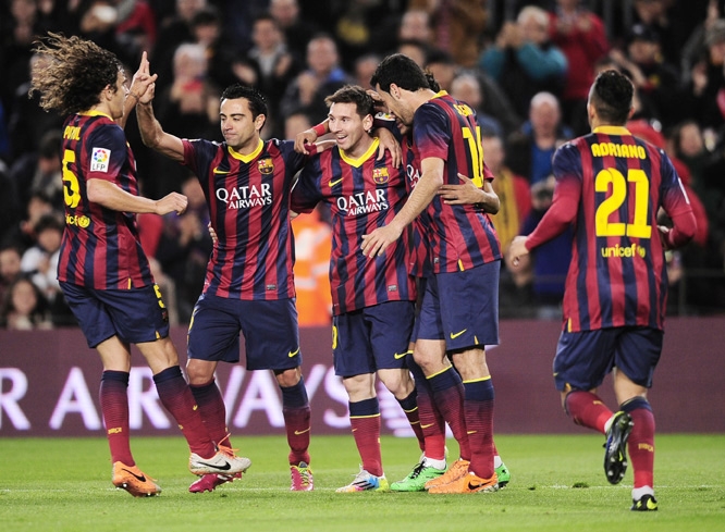 FC Barcelona's Lionel Messi, from Argentina (center) reacts after scoring with his teammates against Almeria during a Spanish La Liga soccer match at the Camp Nou Stadium in Barcelona, Spain on Sunday.