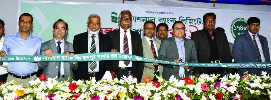 Shamsul Huda Khan, Deputy Managing Director of National Bank Limited inaugurating the 174th branch of the bank at Phulpur in Mymensingh on Tuesday. Mohammad Salim, Executive Vice President and Head of System and Operations Division of the bank presided.