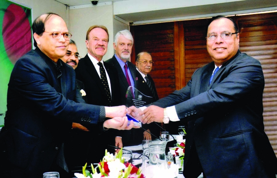Managing Director and CEO of Pubali Bank Limited Helal Ahmed Chowdhury receives award from Dr Atiur Rahman, Governor of Bangladesh Bank for remarkable contribution in remittance earning. US Ambassador Dan W Mozena, European Union Ambassador William Hanna,