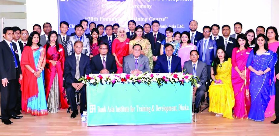 A Rouf Chowdhury, Chairman of Bank Asia, poses with participants of 30th Foundation Training Course after handing over certificates at the concluding day held at its Institute for Training & Development, Tejgaon, Dhaka on Monday.