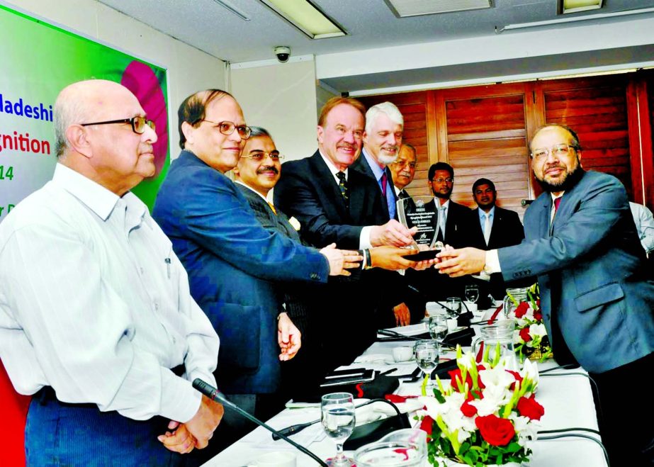 Bangladesh Bank Governor Dr Atiur Rahman, handing over gold medal to Mohammad Abdul Mannan, Managing Director of Islami Bank for earning highest remittance organized by Centre for NRBs. The bank also received "Branding Bangladesh Award" for its contribu
