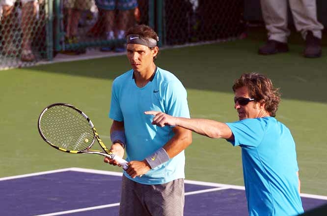 Rafael Nadal (left) of Spain talks to one of his coaches, Francisco Roig as he practises at the BNP Paribas Open tennis tournament in Indian Wells, Calif on Tuesday.