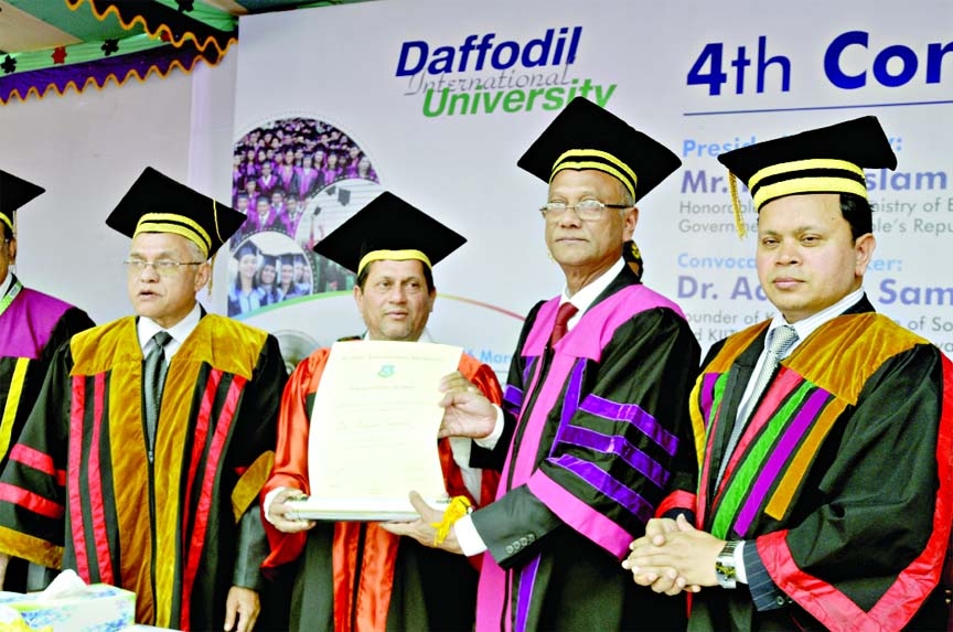 On the occasion of the 4th convocation of Daffodil International University Dr Achyuta Samanata founder of Kaliganga Institute of Social Science receiving Honorary D Liit from Education Minister Nurul Islam Nahid on Thursday. Among others Md Sabur Khan, C