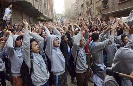 Supporters of Islamist President Mohamed Mursi, who was overthrown by the army after demonstrations against his rule last July, shout slogans during a protest in Omranya area, south of Cairo.