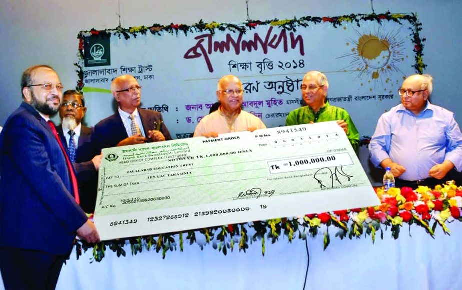 Finance Minister Abul Maal Abdul Muhith receives a cheque of Tk 10 lakh on behalf of Jalalabad Education Trust from Mohammad Abdul Mannan, Managing Director of Islami Bank Bangladesh Limited on Friday. Dr Farashuddin, Chairman of the Trust presided.