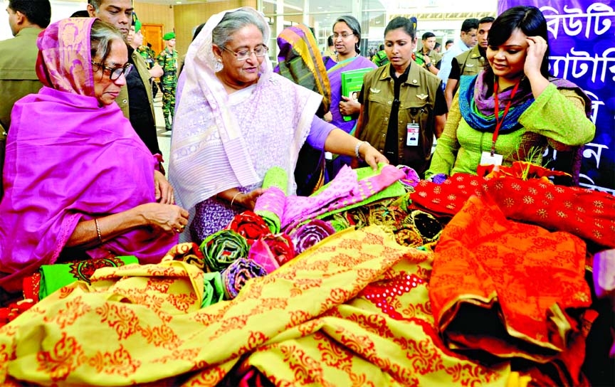 Prime Minister Sheikh Hasina visiting stalls of various items made by the women at Bangabandhu Int'l Conference Centre on the occasion of Int'l Womenâ€™s Day on Saturday.