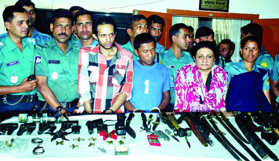 Police raided a house at Banani and arrested four persons including a woman along with arms, ammo, walkie-talkie and other lethal weapons on Sunday.