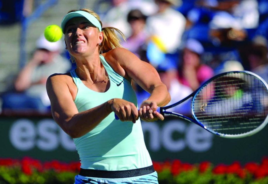 Maria Sharapova of Russia hits to Camila Giorgi of Italy during a third round match at the BNP Paribas Open tennis tournament in Indian Wells Calif on Monday.