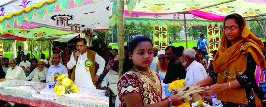 GAFARGAON (Mymensingh): Shahadat Hossain Foundation in Gafargaon distributing scholarship among 250 students of Shahadat Hossain Memorial Govt Primary School at Kukshair viallge on Monday.