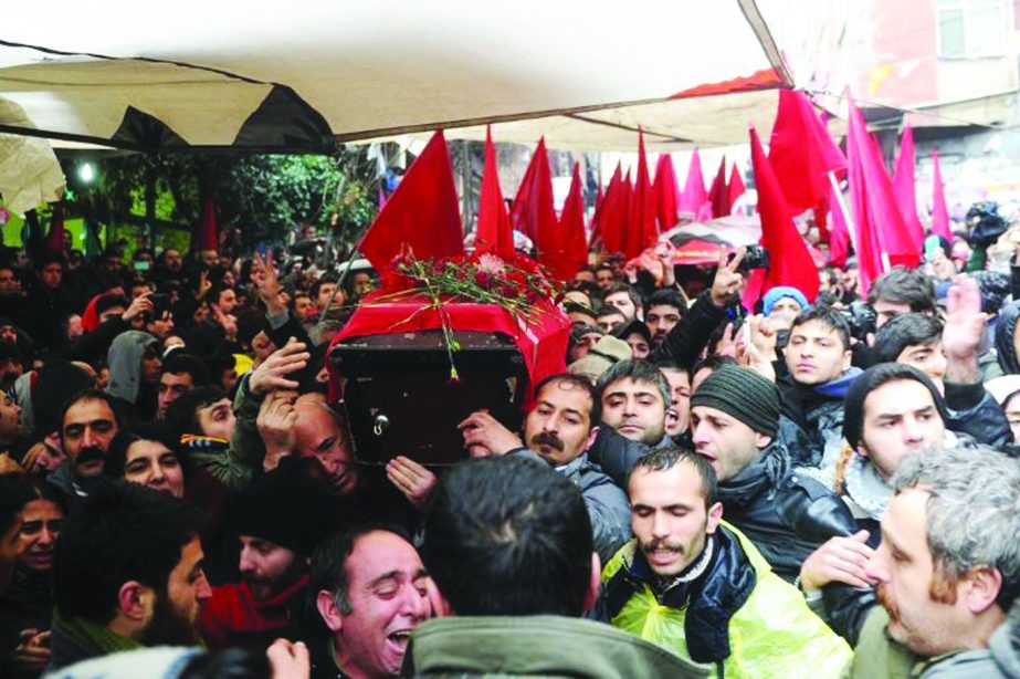 The coffin of Berkin Elvan is carried through the streets of Istanbul.