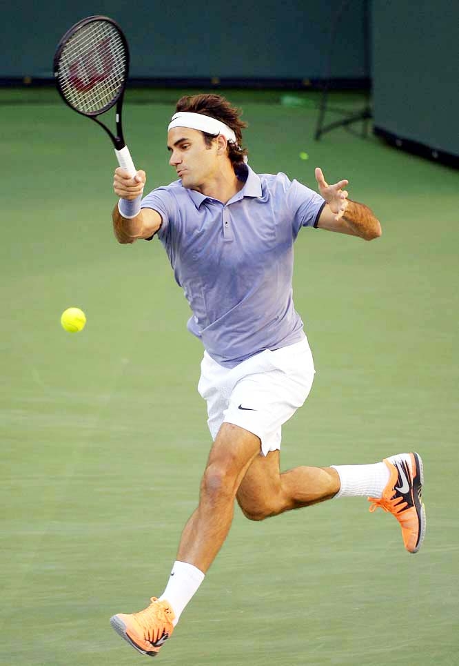 Roger Federer of Switzerland, returns a shot toTommy Haas of Germany at the BNP Paribas Open tennis tournament in Indian Wells, Calif on Wednesday.