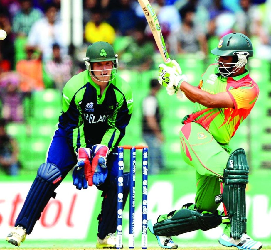 Tamim Iqbal hitting a shot during World T20 warm-up match between Bangladesh and Ireland at Fatullah on Friday.