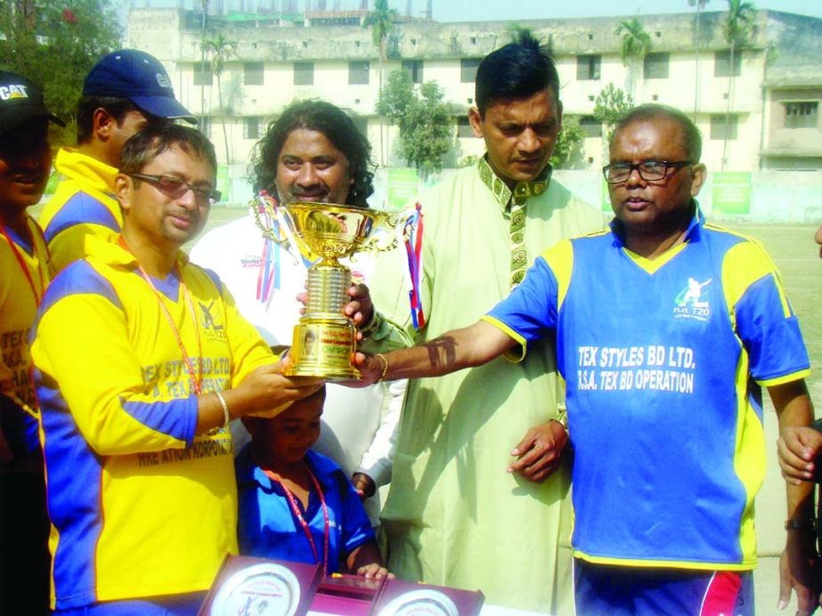 Bangla Trac, the champions of the Raman Lamba Twenty20 Cricket Tournament receiving the winners trophy at the City Club Ground on Friday.