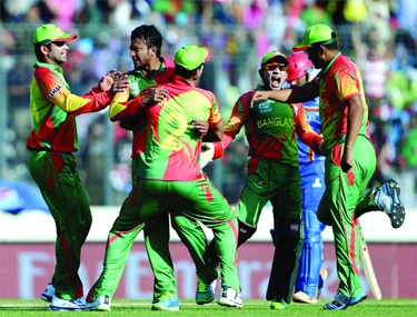 Players of Bangladesh celebrate after dismissal of an Afghanistan batsman in the Group A match of the ICC World Twenty20 Cricket between Bangladesh and Afghanistan at the Sher-e-Bangla National Cricket Stadium in Mirpur on Sunday.