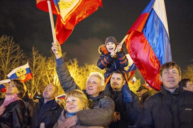 Pro-Russian people celebrate in the central square in Sevastopol, Ukraine, early on Monday. Russian flags fluttered above jubilant crowds Sunday after residents in Crimea voted overwhelmingly to secede from Ukraine and join Russia.