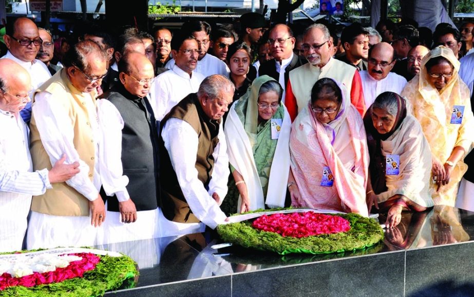 Prime Minister Sheikh Hasina along with party leaders paying tributes to Bangabandhu Sheikh Mujibur Rahman by placing floral wreaths on his portrait at 32 No Dhanmondi in the city on Monday on the occasion of his 94th birth anniversary.