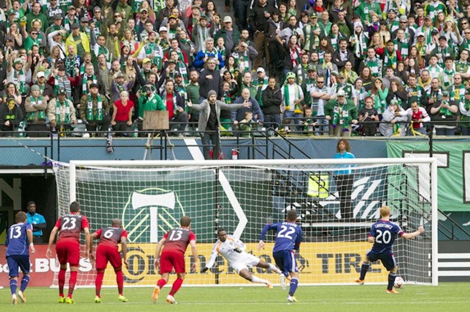 Portland Timbers goalkeeper Donovan Ricketts (1) goes the wrong direction on a penalty kick by Chicago Fire midfielder Jeff Larentowicz (20) as the during an MLS soccer game Providence Park in Portland. The game ended in a 1-1 tie on Sunday.